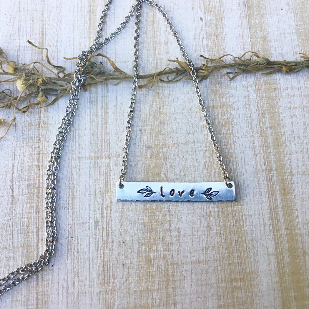 Love stamped bar necklace with leaves